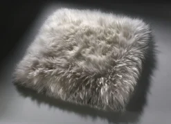 BADER Merino-Lammfell-Sitzauflage in Tierform TAUPE